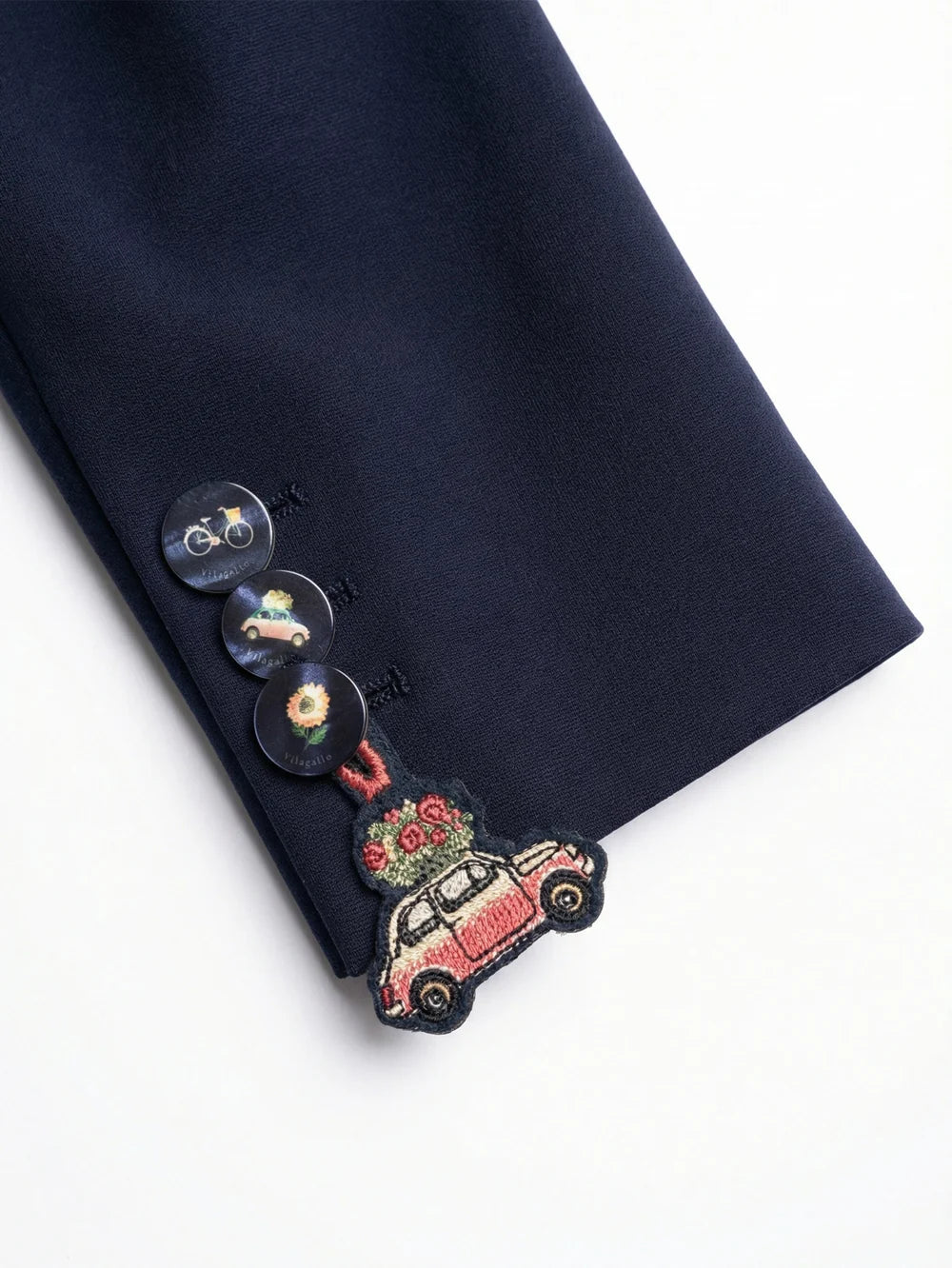 Vilagallo navy blazer close-up showing decorative cuff buttons and embroidery