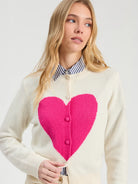 Vilagallo ecru cardigan with oversized fuchsia intarsia heart – close model view