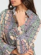 Vilagallo geometric print shirt close-up showing peach green and navy pattern