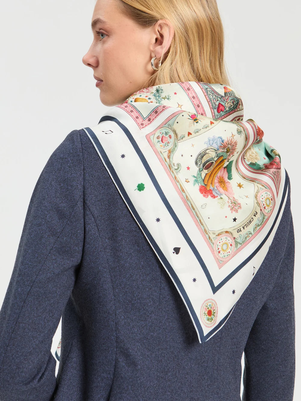 Vilagallo Madrid illustrated silk scarf styled around the shoulders