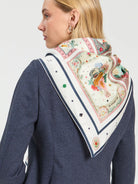 Vilagallo Madrid illustrated silk scarf styled around the shoulders